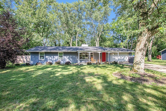 3365 Circle Dr, Saint Joseph, MI 49085 - single story home with a front lawn, covered porch, brick siding, and an attached garage