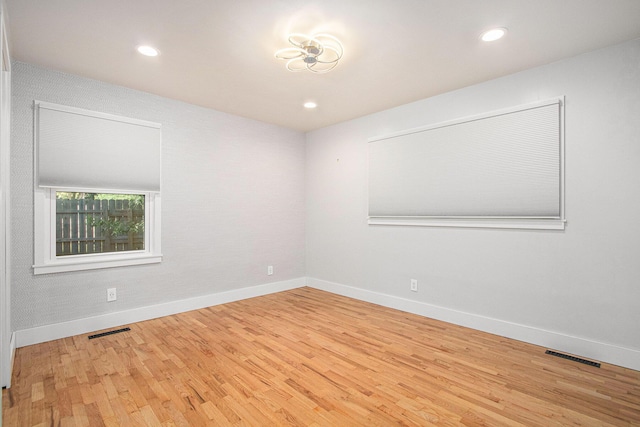 3365 Circle Dr, Saint Joseph, MI 49085 - empty room featuring wood finished floors and recessed lighting