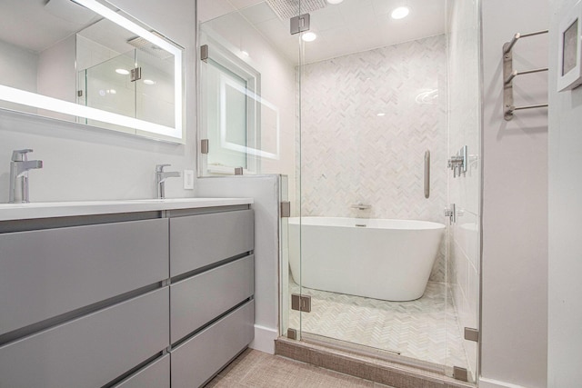 3365 Circle Dr, Saint Joseph, MI 49085 - bathroom featuring a freestanding bath, a shower stall, double vanity, and recessed lighting