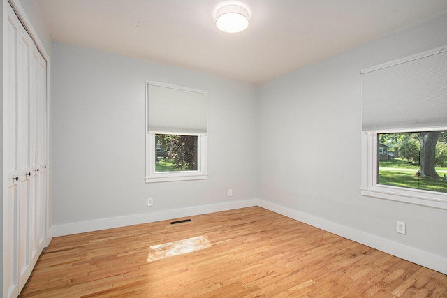 3365 Circle Dr, Saint Joseph, MI 49085 - unfurnished bedroom with wood finished floors and a closet