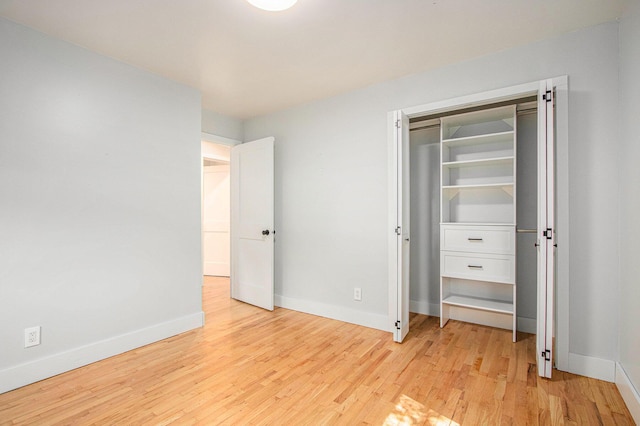 3365 Circle Dr, Saint Joseph, MI 49085 - unfurnished bedroom featuring light wood-style floors and a closet