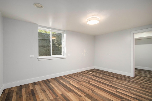 3365 Circle Dr, Saint Joseph, MI 49085 - unfurnished bedroom featuring dark wood-style floors, a closet, and a walk in closet