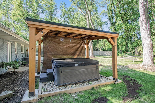 3365 Circle Dr, Saint Joseph, MI 49085 - view of green lawn with a hot tub and a trampoline