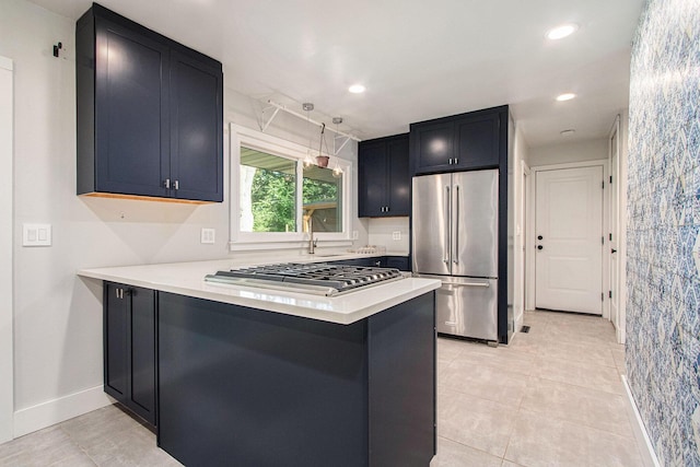 3365 Circle Dr, Saint Joseph, MI 49085 - kitchen with appliances with stainless steel finishes, a peninsula, light countertops, light tile patterned floors, and recessed lighting