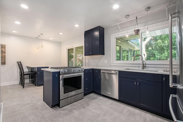 3365 Circle Dr, Saint Joseph, MI 49085 - kitchen featuring appliances with stainless steel finishes, a peninsula, light countertops, recessed lighting, and hanging light fixtures