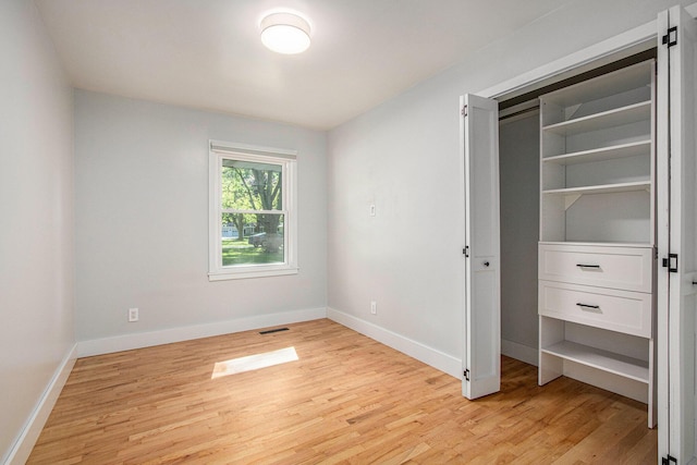 3365 Circle Dr, Saint Joseph, MI 49085 - unfurnished bedroom with light wood-style flooring and baseboards