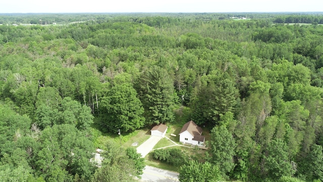 17324 11 Mile Rd, Leroy, MI 49655 - aerial view of property and surrounding area featuring a heavily wooded area