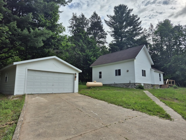 17324 11 Mile Rd, Leroy, MI 49655 - view of side of property with an outbuilding, a garage, and a lawn