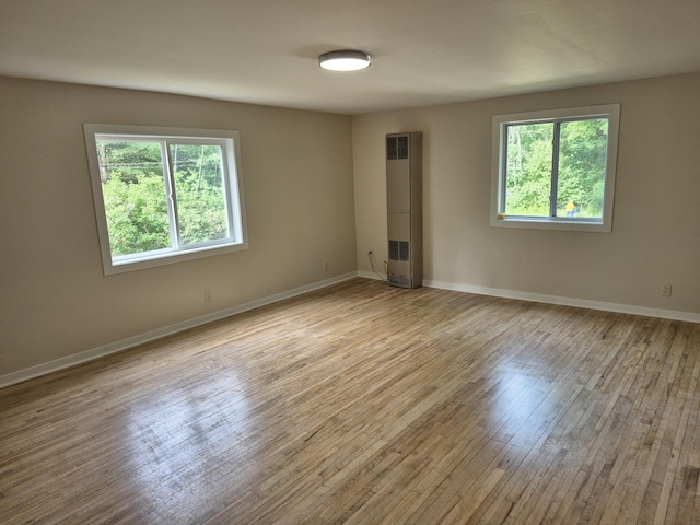 17324 11 Mile Rd, Leroy, MI 49655 - unfurnished room featuring light wood-style floors and baseboards