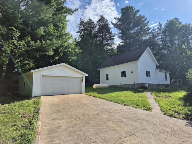 17324 11 Mile Rd, Leroy, MI 49655 - view of front of house featuring a detached garage, an outbuilding, and a front yard