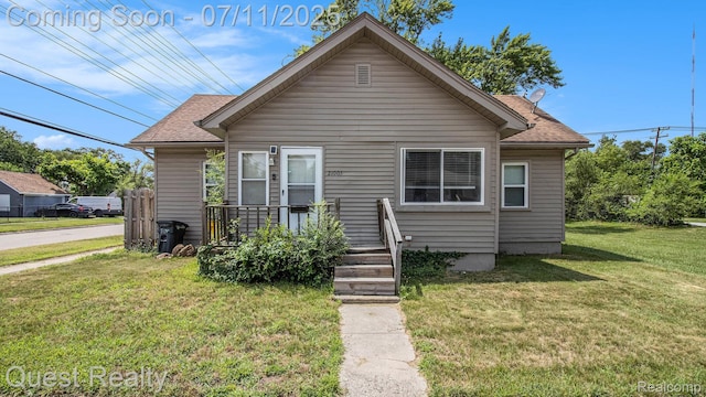 21005 Westview Ave, Ferndale, MI 48220 - bungalow-style house with a front yard and a shingled roof
