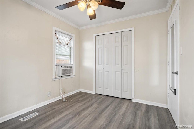 1771 E George Ave, Hazel Park, MI 48030 - unfurnished bedroom with wood finished floors, cooling unit, a closet, ornamental molding, and a ceiling fan