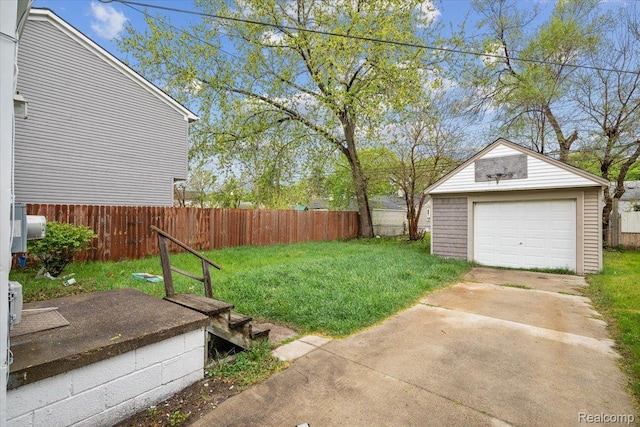 1771 E George Ave, Hazel Park, MI 48030 - view of yard featuring an outdoor structure, a garage, and driveway