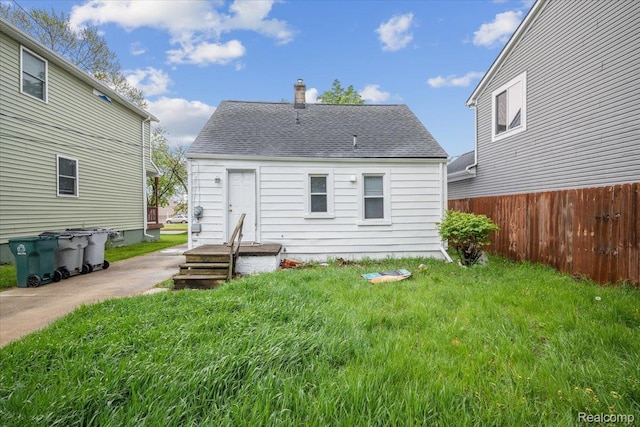 1771 E George Ave, Hazel Park, MI 48030 - back of house with a chimney and roof with shingles