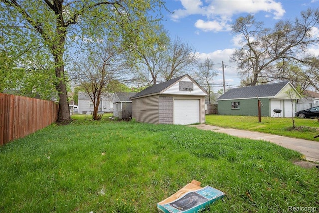 1771 E George Ave, Hazel Park, MI 48030 - view of yard featuring an outbuilding, a garage, and driveway