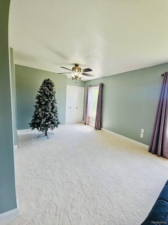 4383 Eagle Ln, Burton, MI 48519 - carpeted empty room with ceiling fan and a textured ceiling