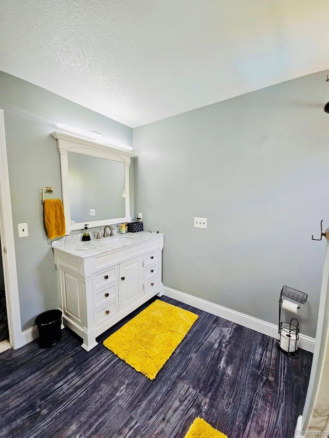 4383 Eagle Ln, Burton, MI 48519 - bathroom with vanity and wood finished floors