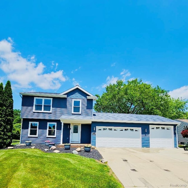 4383 Eagle Ln, Burton, MI 48519 - view of front of house featuring a garage, a front yard, and concrete driveway