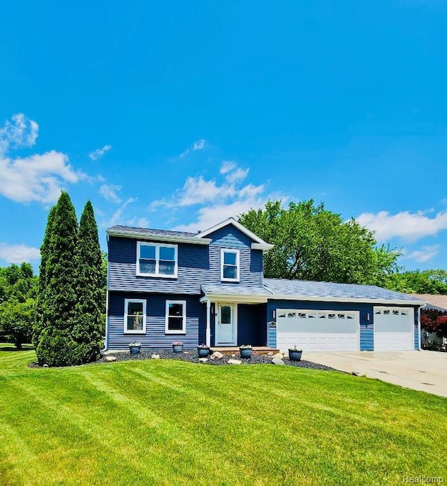4383 Eagle Ln, Burton, MI 48519 - traditional-style home featuring a garage, a front yard, and driveway