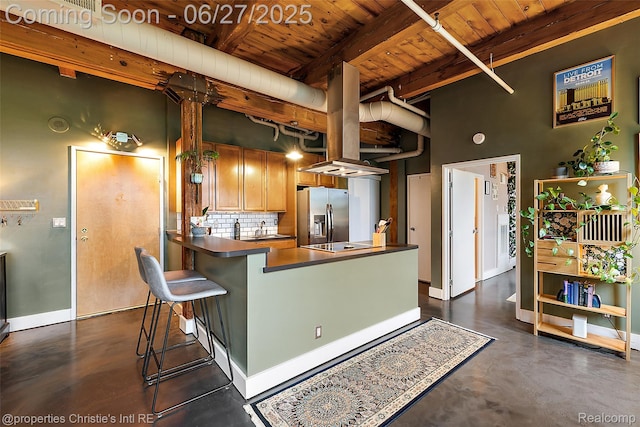 6533 E Jefferson Ave Unit 312W, Detroit, MI 48207 - kitchen featuring a wooden ceiling with exposed beams, stainless steel fridge with ice dispenser, decorative backsplash, concrete flooring, and dark countertops
