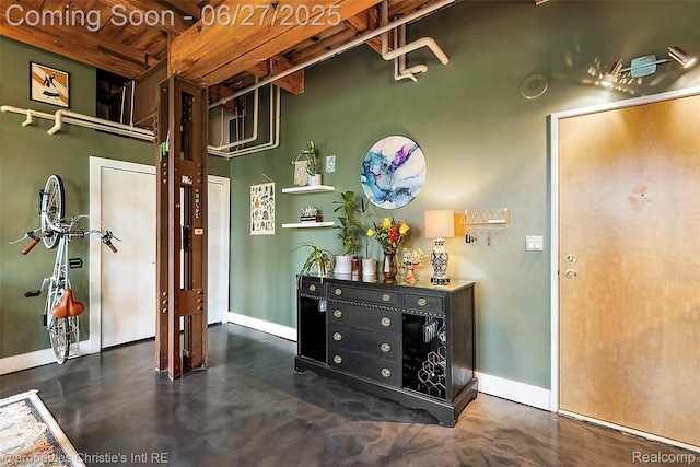 6533 E Jefferson Ave Unit 312W, Detroit, MI 48207 - corridor featuring concrete flooring and baseboards