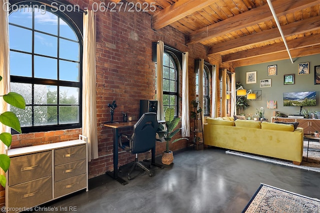 6533 E Jefferson Ave Unit 312W, Detroit, MI 48207 - office featuring plenty of natural light, finished concrete flooring, a wooden ceiling with exposed beams, and brick wall