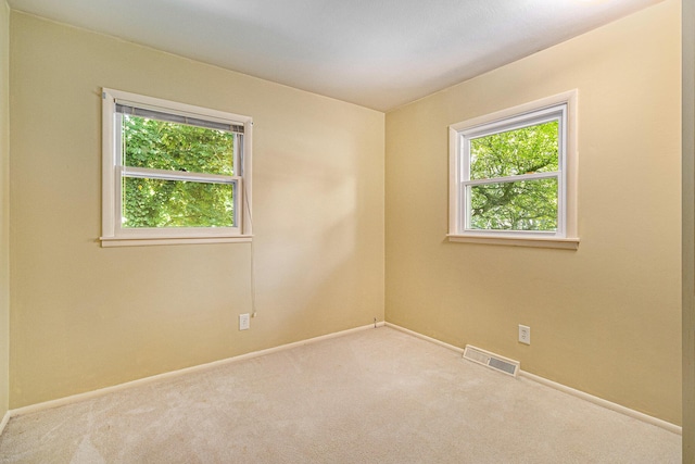 4650 Rollridge Ave, Kalamazoo, MI 49004 - spare room featuring carpet floors and baseboards