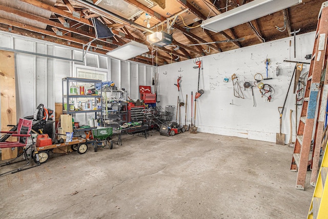4650 Rollridge Ave, Kalamazoo, MI 49004 - garage featuring a workshop area and a garage door opener