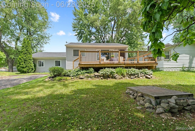 4860 Lindholm Dr, White Lake, MI 48383 - view of front of property with a deck and a front yard