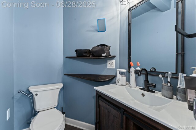 4860 Lindholm Dr, White Lake, MI 48383 - bathroom with toilet and vanity