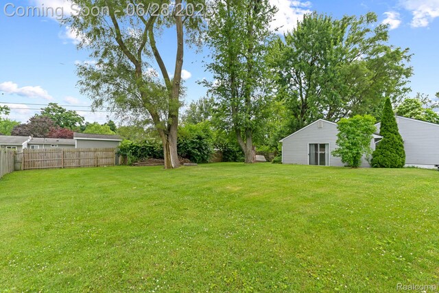 4860 Lindholm Dr, White Lake, MI 48383 - view of yard with an outdoor structure