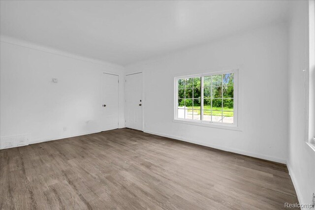 19966 Lindsay St, Detroit, MI 48235 - spare room featuring wood finished floors