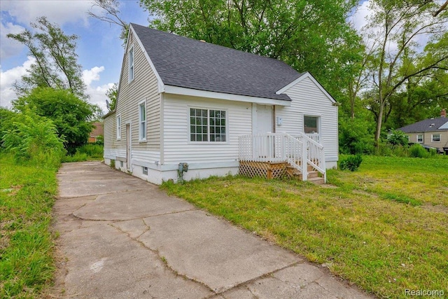 19966 Lindsay St, Detroit, MI 48235 - view of front of home featuring a shingled roof and driveway