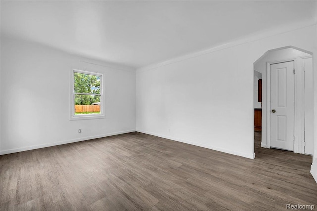 19966 Lindsay St, Detroit, MI 48235 - empty room featuring wood finished floors and arched walkways