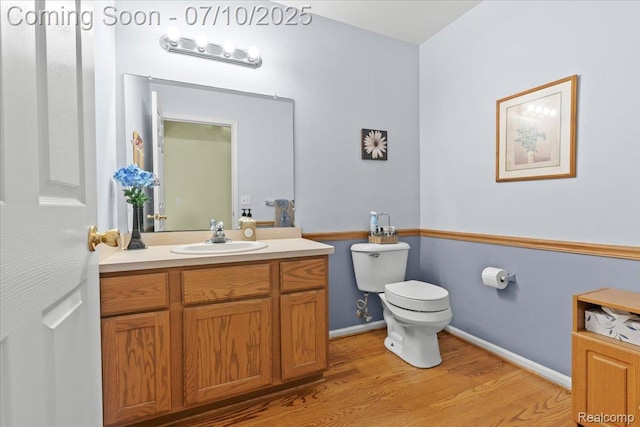 12366 Orchard Wood Dr, Fenton, MI 48430 - half bathroom featuring wood finished floors and vanity