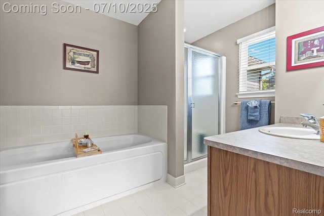 12366 Orchard Wood Dr, Fenton, MI 48430 - bathroom with tile patterned floors, a shower stall, a bath, and vanity