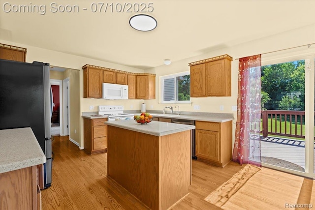 12366 Orchard Wood Dr, Fenton, MI 48430 - kitchen featuring appliances with stainless steel finishes, light countertops, and light wood-style floors