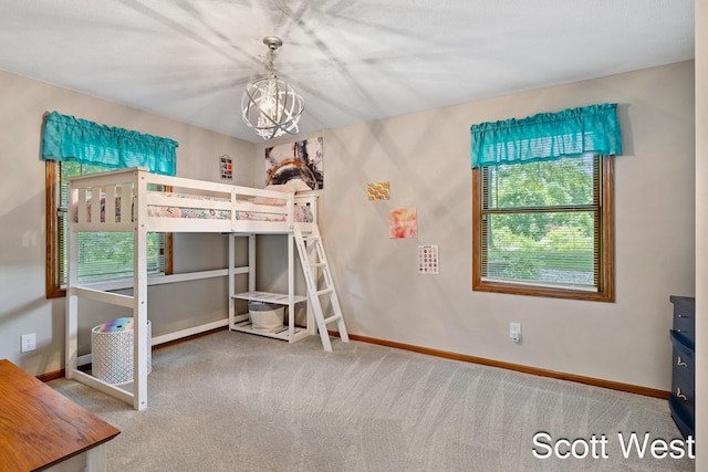 2730 Wellspring Ct NW, Grand Rapids, MI 49504 - carpeted bedroom with a chandelier and baseboards