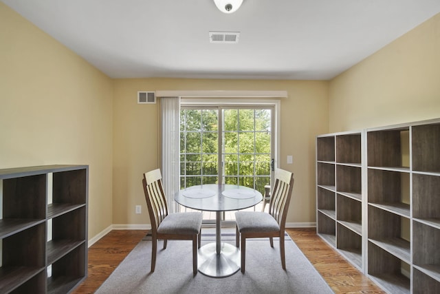 662 Village Ln, Milford, MI 48381 - dining space featuring baseboards and wood finished floors