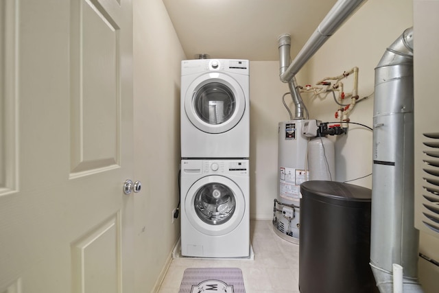662 Village Ln, Milford, MI 48381 - laundry room featuring stacked washer / drying machine, gas water heater, and tile patterned floors