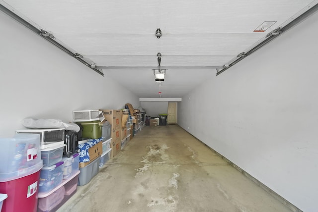 662 Village Ln, Milford, MI 48381 - garage featuring a garage door opener