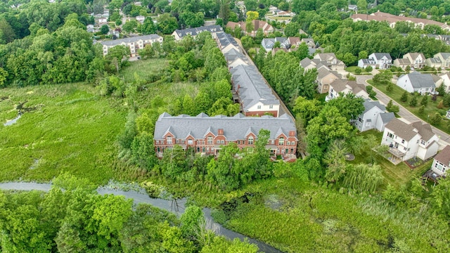 662 Village Ln, Milford, MI 48381 - aerial perspective of suburban area featuring a tree filled landscape