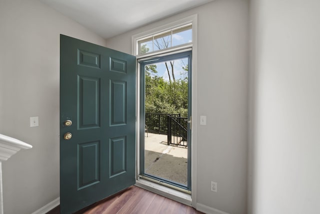 662 Village Ln, Milford, MI 48381 - foyer featuring dark wood-type flooring and baseboards