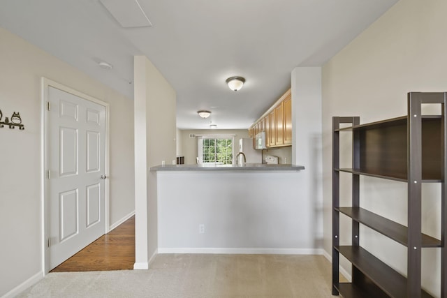 662 Village Ln, Milford, MI 48381 - kitchen featuring carpet flooring and white microwave