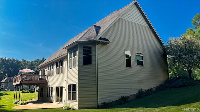 5580 Birch Ln, Davisburg, MI 48350 - view of property exterior featuring a yard, a deck, and a patio area