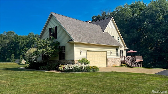 5580 Birch Ln, Davisburg, MI 48350 - view of side of property featuring concrete driveway, roof with shingles, a garage, and a yard