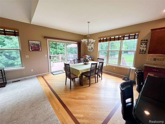 5580 Birch Ln, Davisburg, MI 48350 - dining space featuring healthy amount of natural light, a chandelier, and light wood finished floors