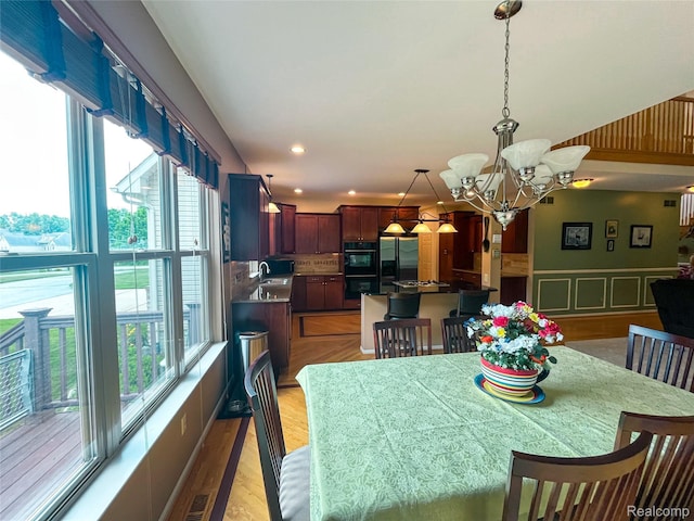 5580 Birch Ln, Davisburg, MI 48350 - dining space with a chandelier, recessed lighting, and light wood-style flooring