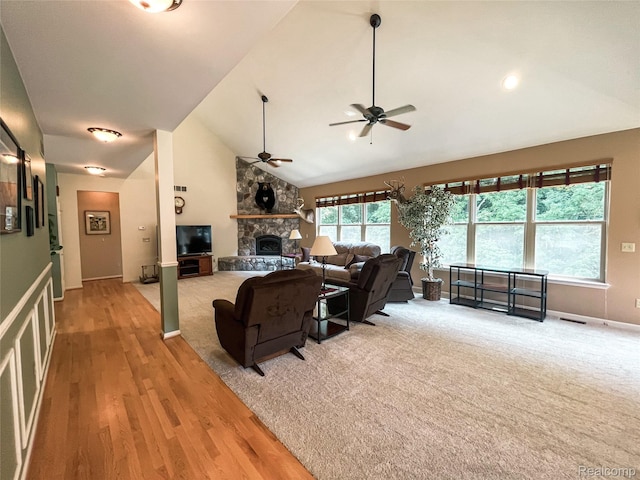 5580 Birch Ln, Davisburg, MI 48350 - living area featuring ceiling fan, a fireplace, light wood finished floors, and high vaulted ceiling