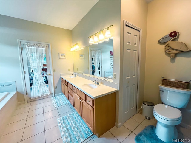 5580 Birch Ln, Davisburg, MI 48350 - bathroom featuring tile patterned floors, double vanity, a bathtub, and a closet